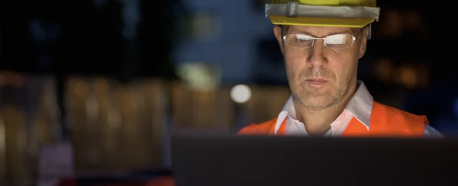 Construction Worker On A Computer.