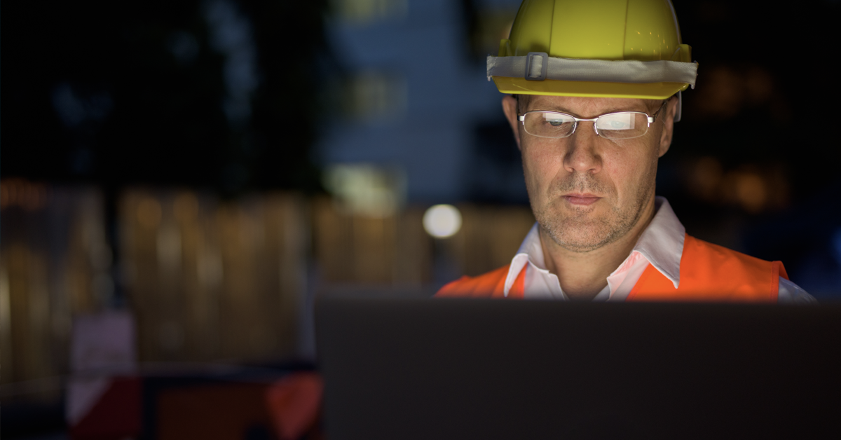 construction worker on a computer.